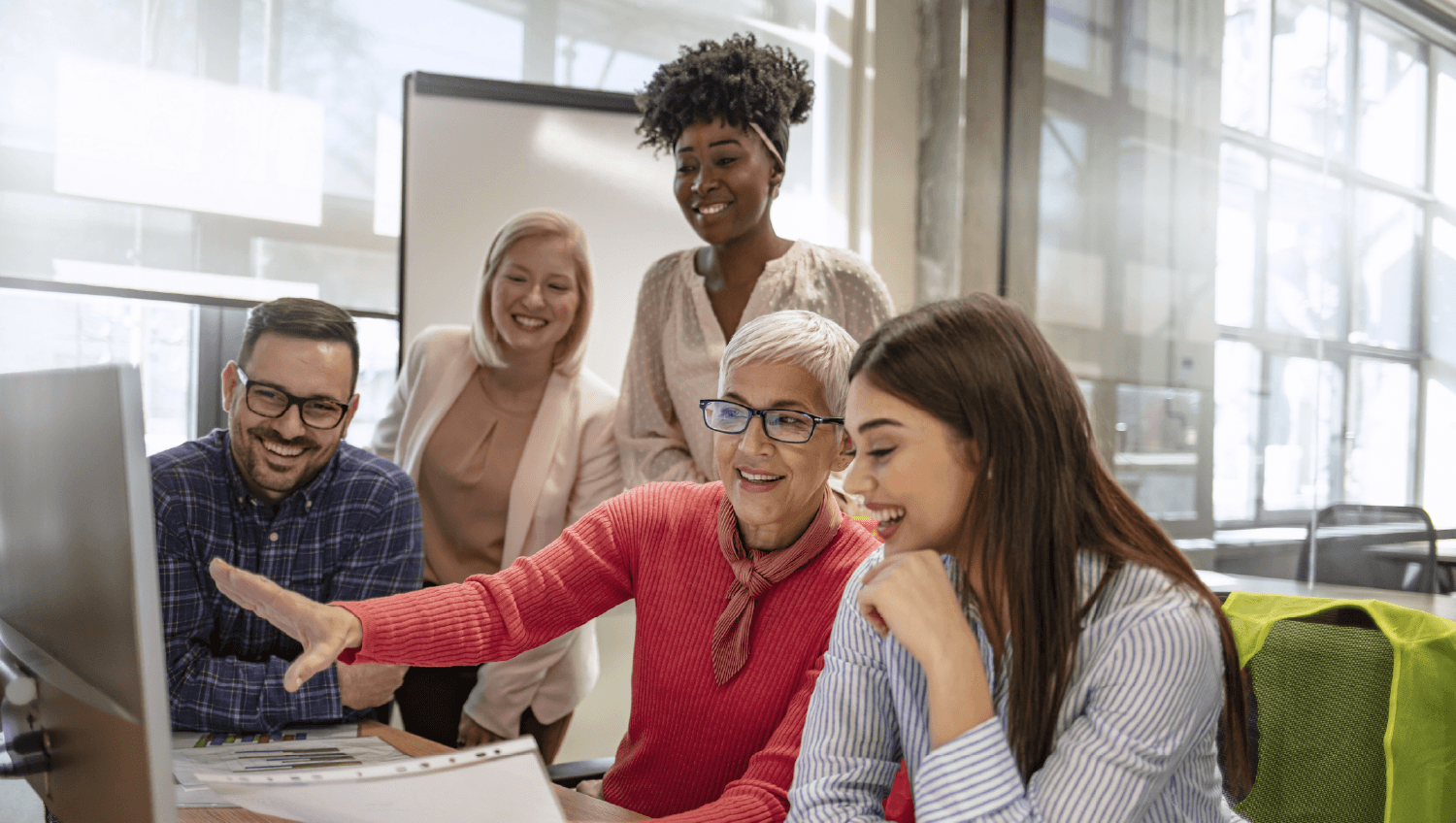 Professionals working together at a computer